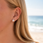 9mm keshi pearl stud earrings in gold vermeil, styled in a natural beach setting with a coastal Australian jewellery vibe