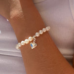 children’s pearl bracelet with silver heart charm 