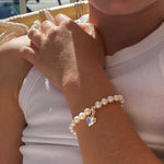 pearl children’s bracelet with silver heart charm  