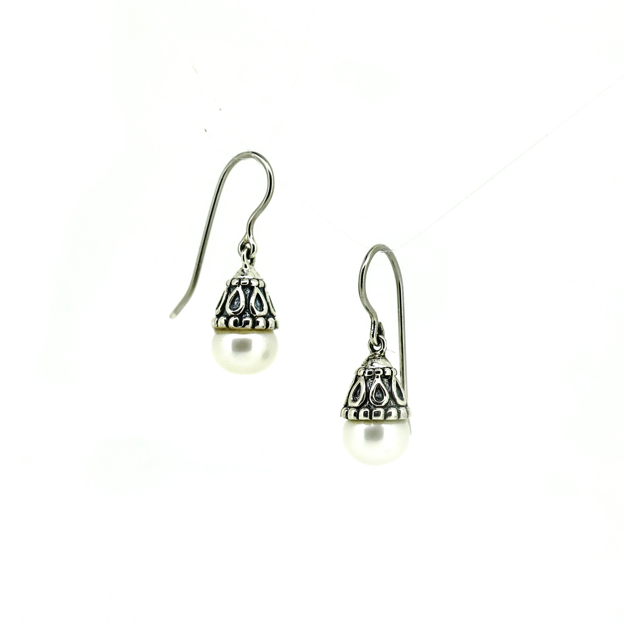 Vintage style silver pearl earrings with ornate cap