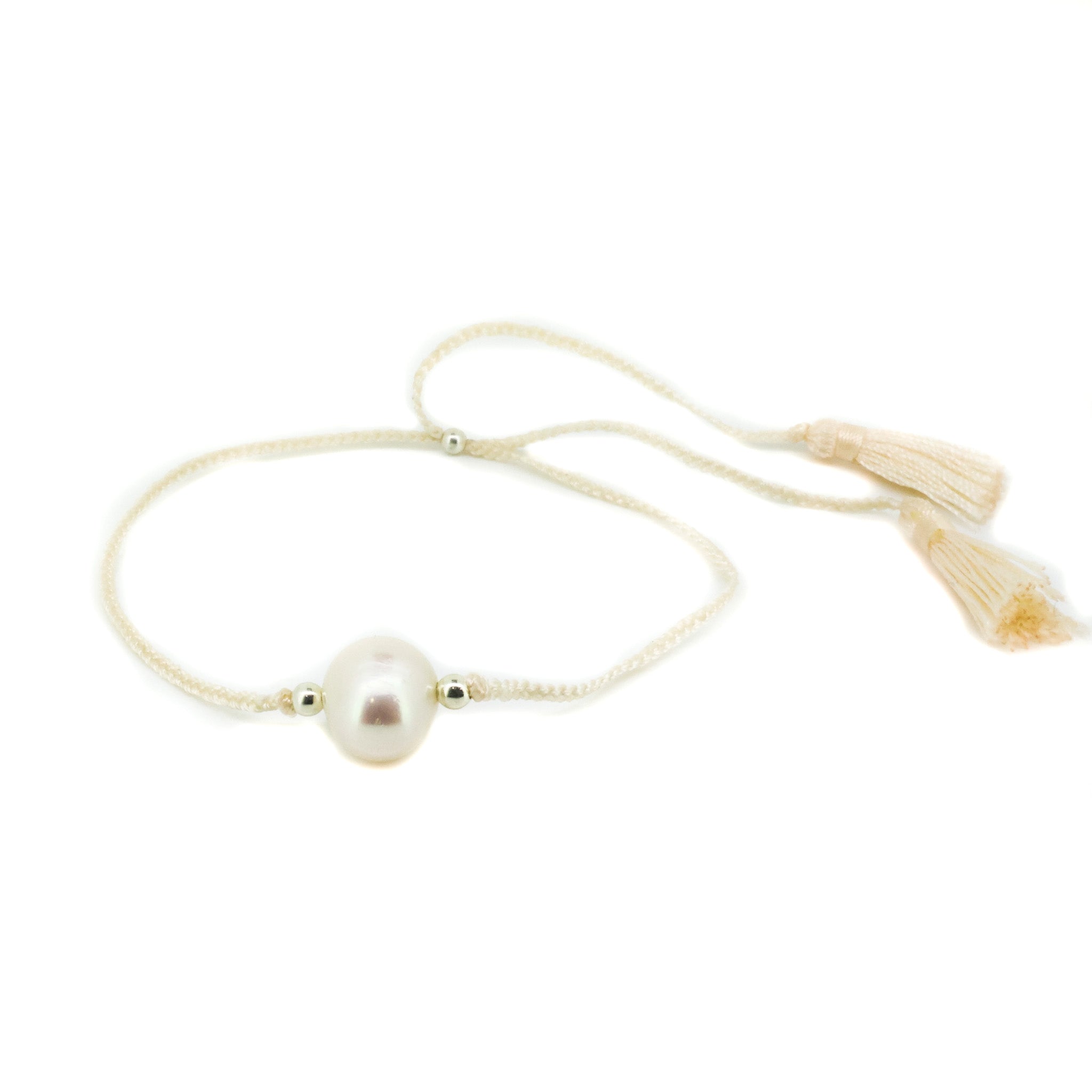 Boho Pearl Cream Tassel Bracelet featuring genuine freshwater pearls and cream tassel detail