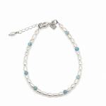 Boho Pearl Larimar Bracelet Silver featuring genuine freshwater seed pearls, soft blue larimar gemstones, sterling silver clasp, and adjustable chain. 