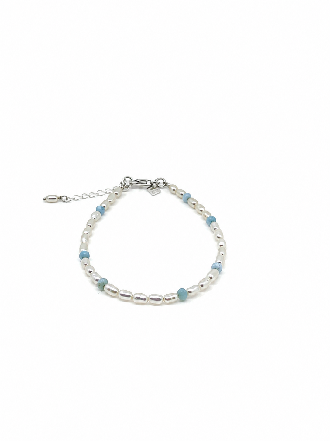 Boho Pearl Larimar Bracelet Silver featuring genuine freshwater seed pearls, soft blue larimar gemstones, sterling silver clasp, and adjustable chain. 