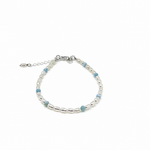 Boho Pearl Larimar Bracelet Silver featuring genuine freshwater seed pearls, soft blue larimar gemstones, sterling silver clasp, and adjustable chain. 