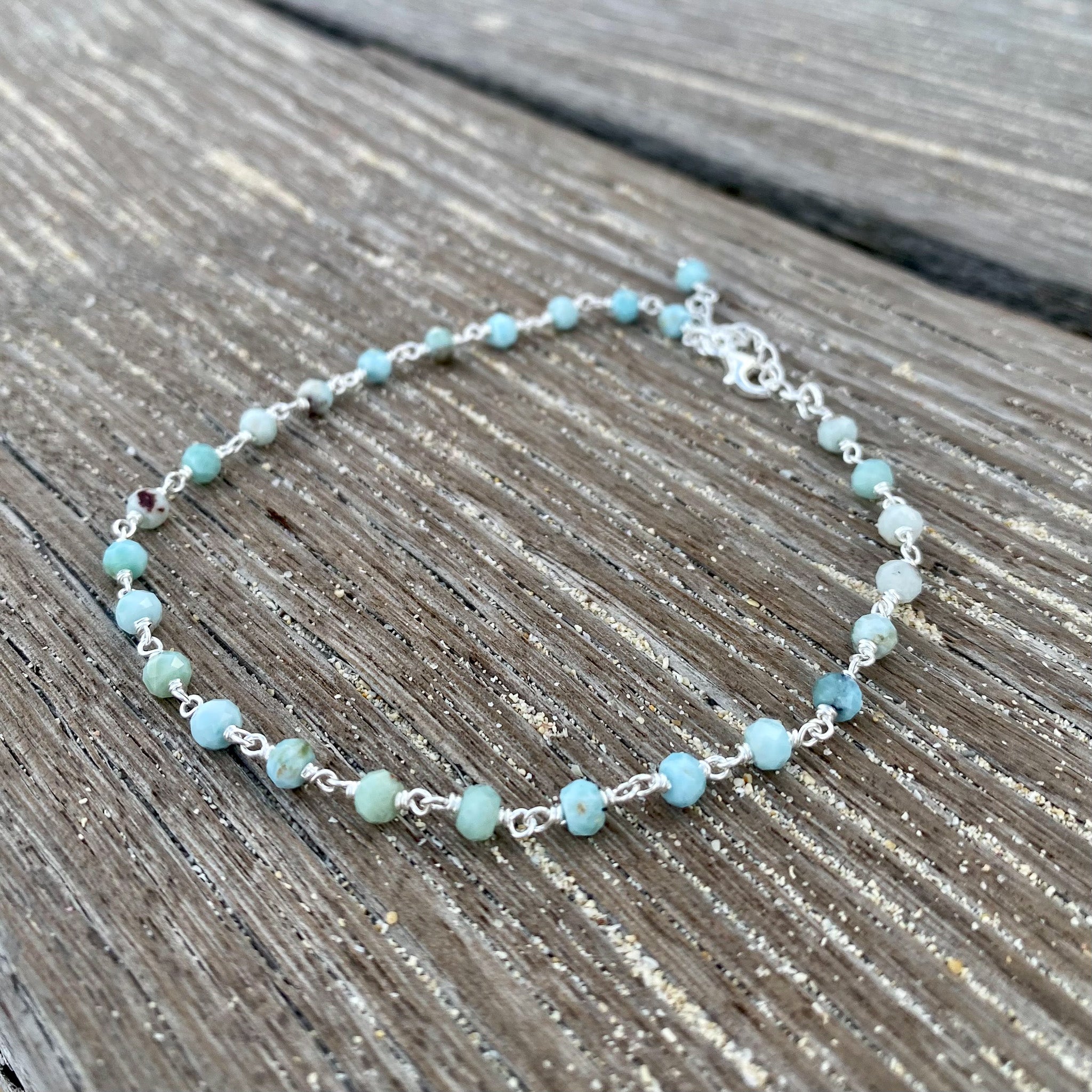 Caribbean Dreams Larimar Anklet Silver by Lush Designs Jewellery featuring natural blue and turquoise larimar gemstone beads, sterling silver links and adjustable clasp with LUSH tag on a white background.