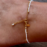 Summer Sun Pearl Anklet Sand by Lush Designs Jewellery featuring white freshwater pearls woven along sand-coloured cord with an adjustable sterling silver clasp, 