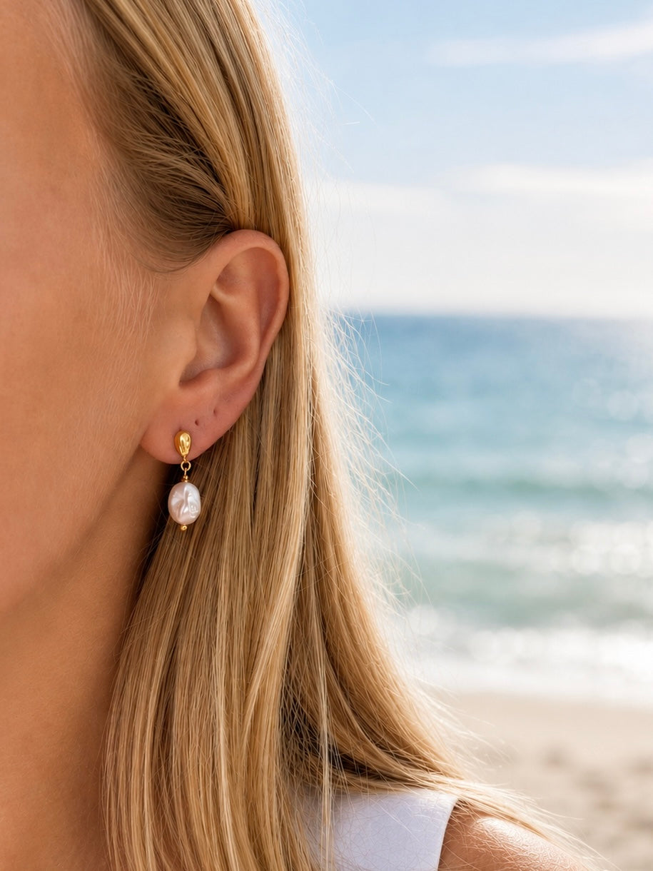 Coastal Dew Drop Baroque Pearl Stud Earrings in gold vermeil worn by model with 10mm freshwater pearl