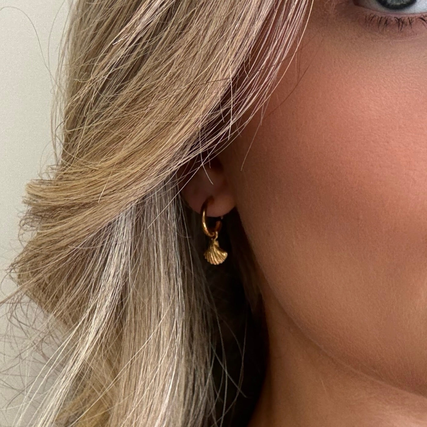 Gold shell sleeper earrings 