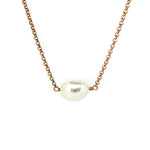 A rose gold vermeil chain necklace with a single Keshi pearl centerpiece.