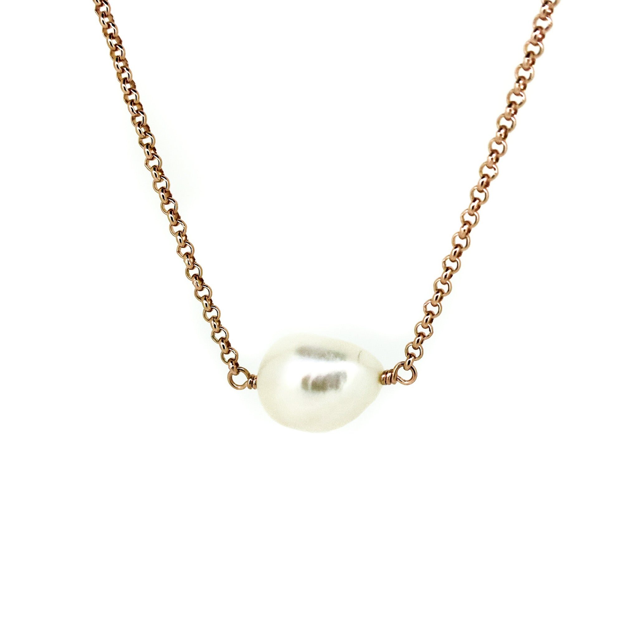 A rose gold vermeil chain necklace with a single Keshi pearl centerpiece.