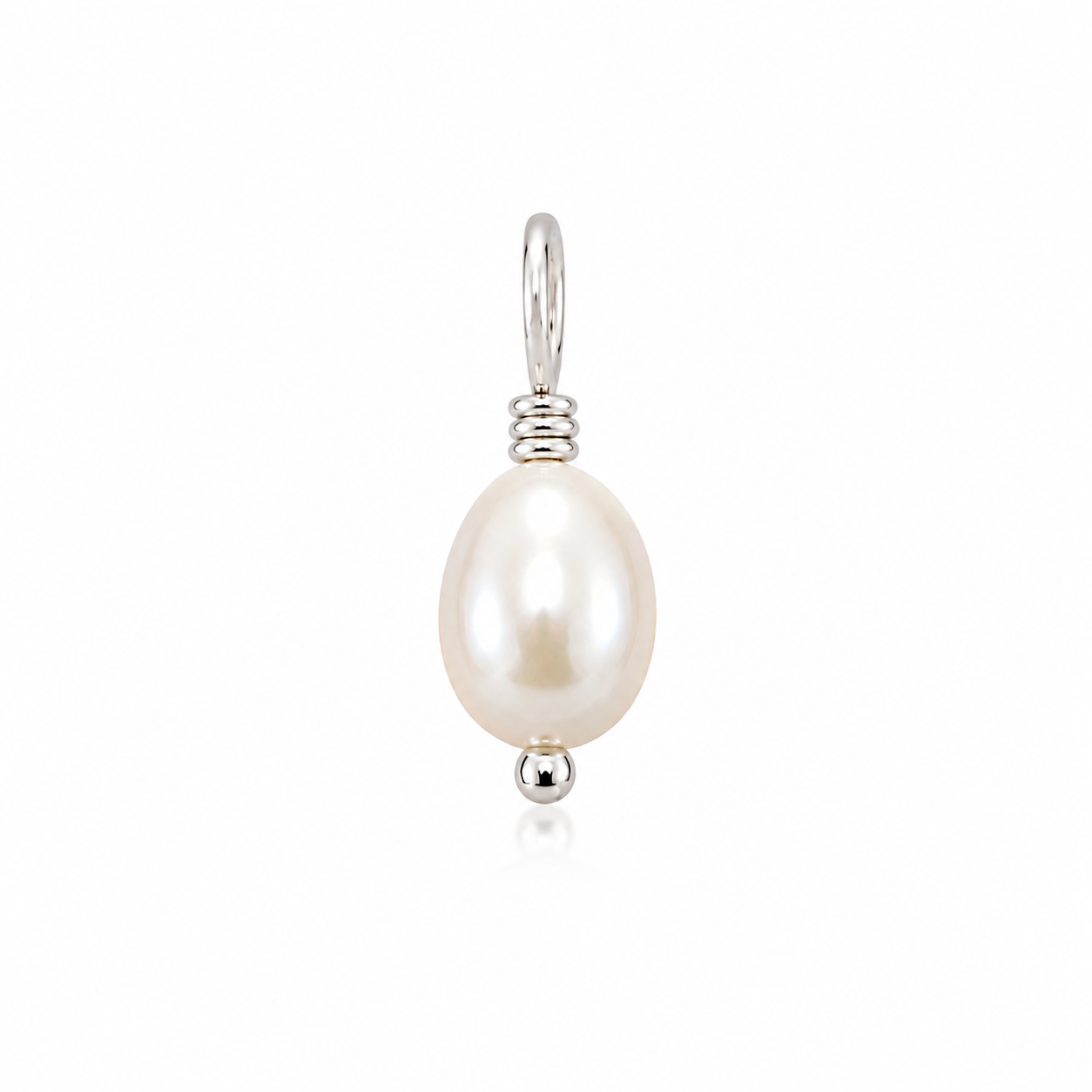 A single freshwater pearl pendant in a silver setting.