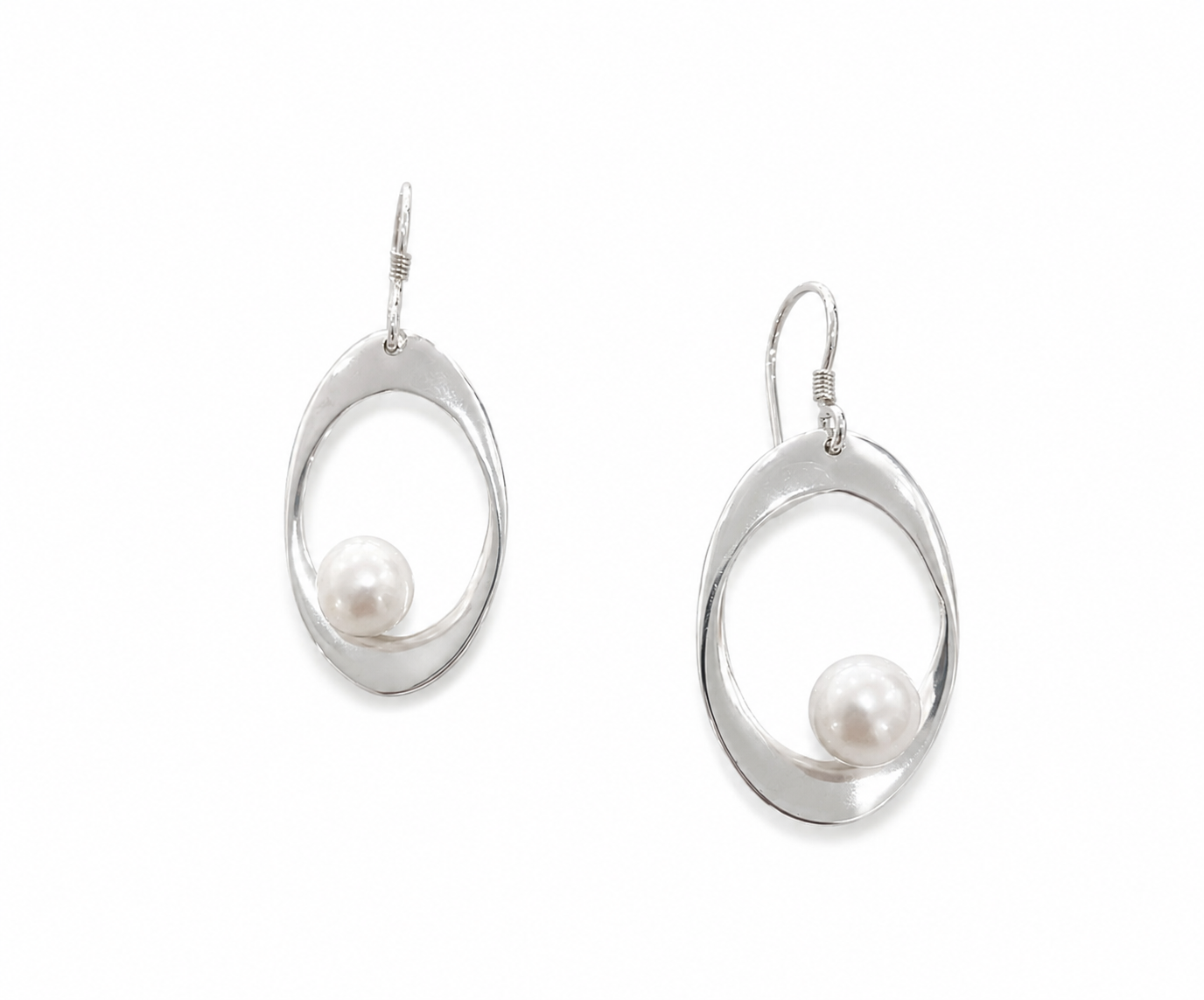 Sterling silver pearl drop earrings featuring organic open teardrop shapes and luminous freshwater pearls, inspired by coastal elegance and designed in Broome, Western Australia.