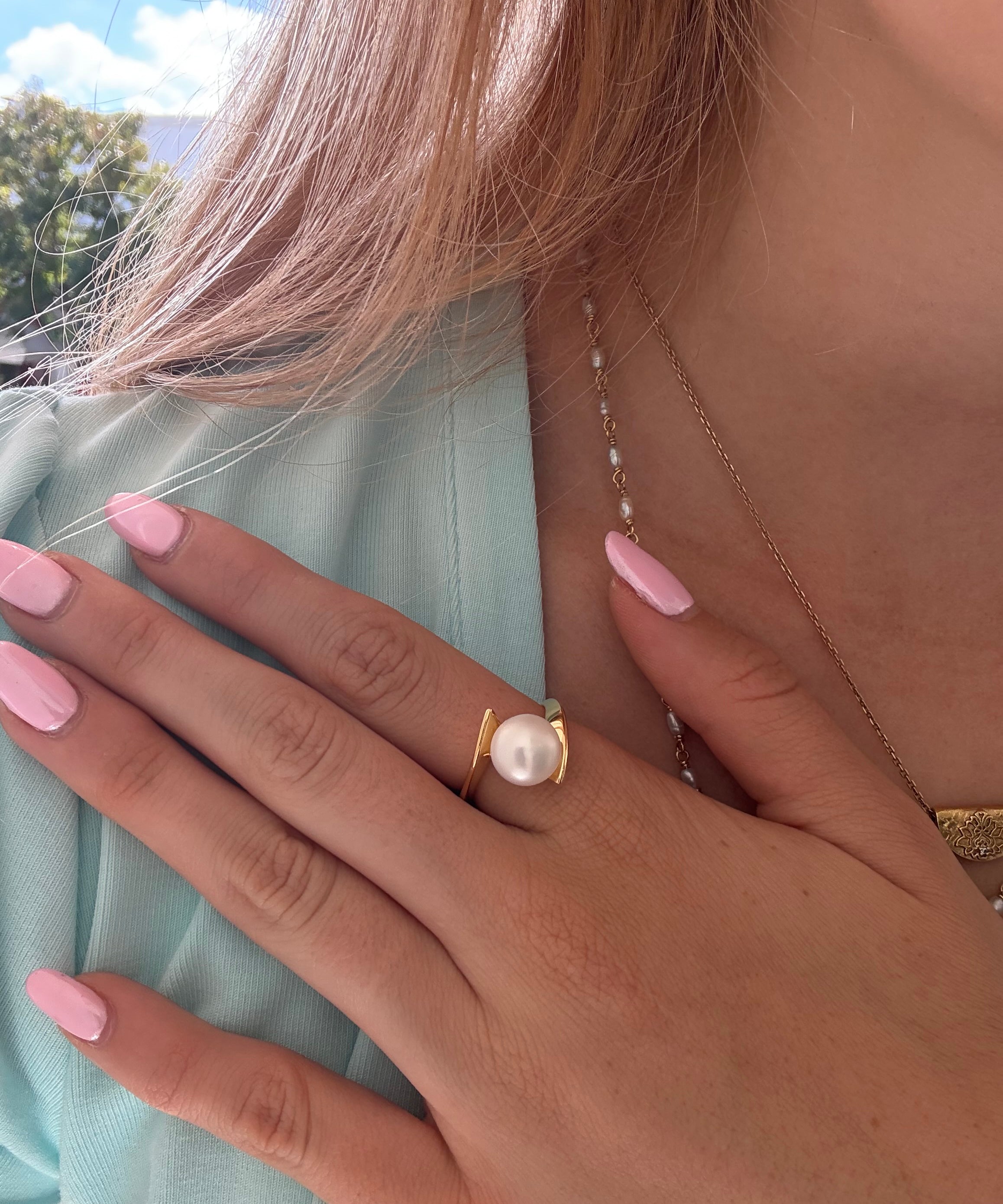 Whirlpool Pearl Ring Gold featuring a genuine freshwater pearl set in a swirling gold vermeil design over 925 sterling silver.