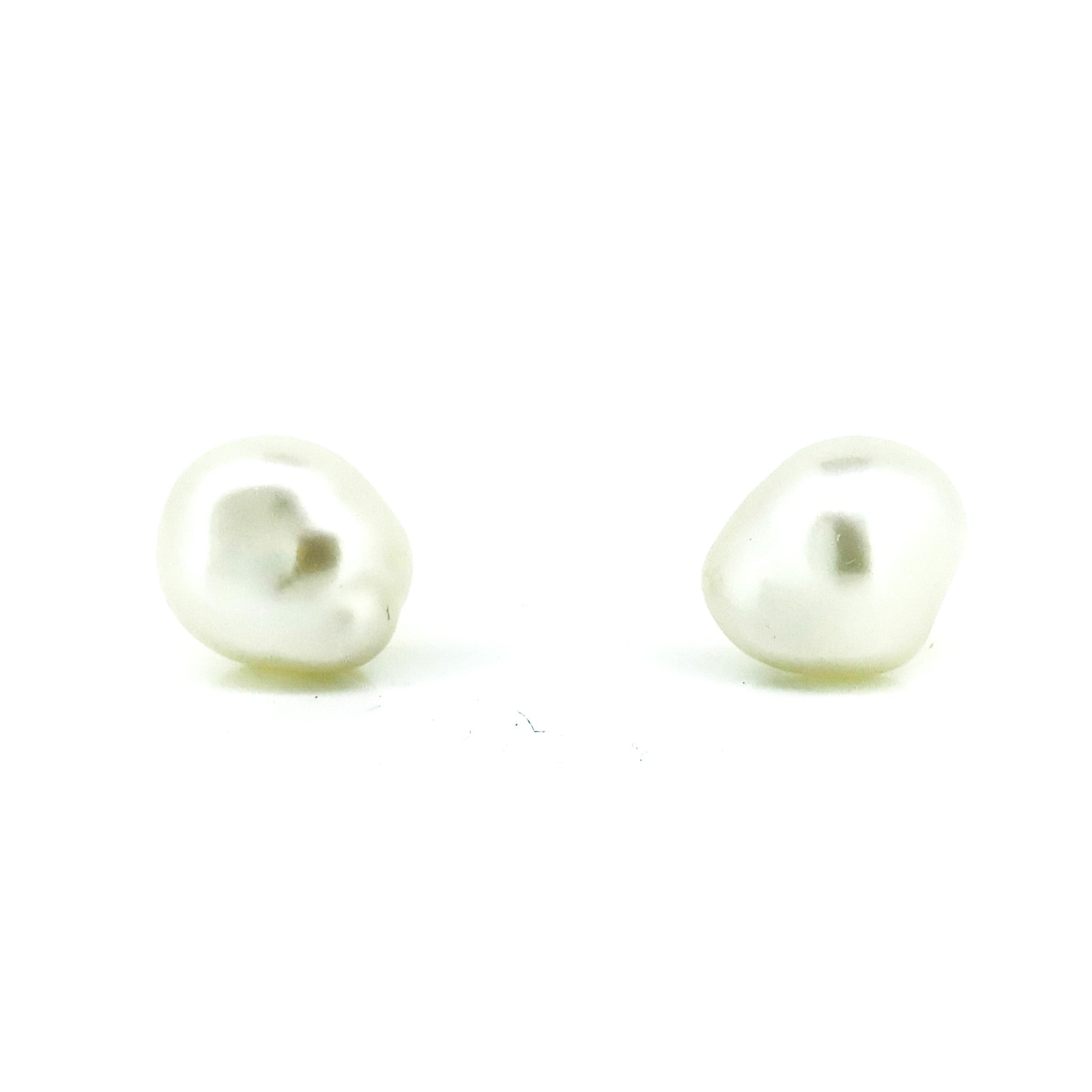 Pair of pearl earrings on a white background