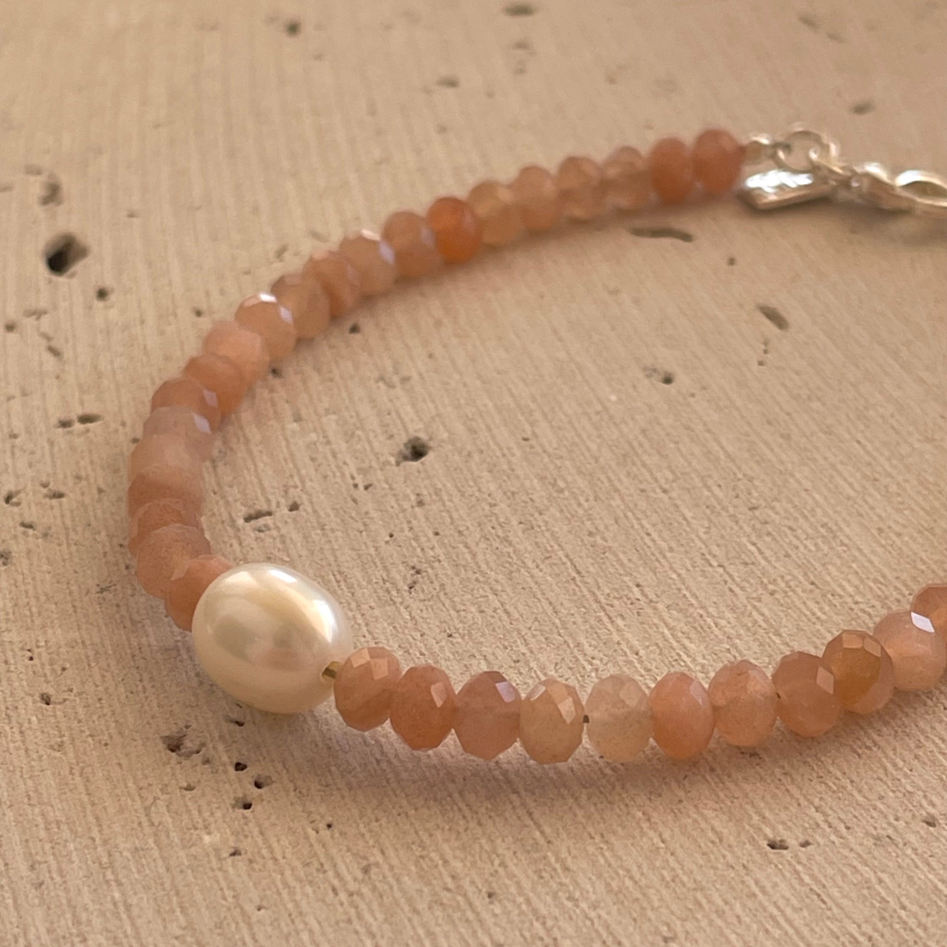 Moonstone Pearl Bracelet Silver featuring faceted peach gemstone beads, a genuine freshwater pearl, sterling silver clasp, and adjustable chain