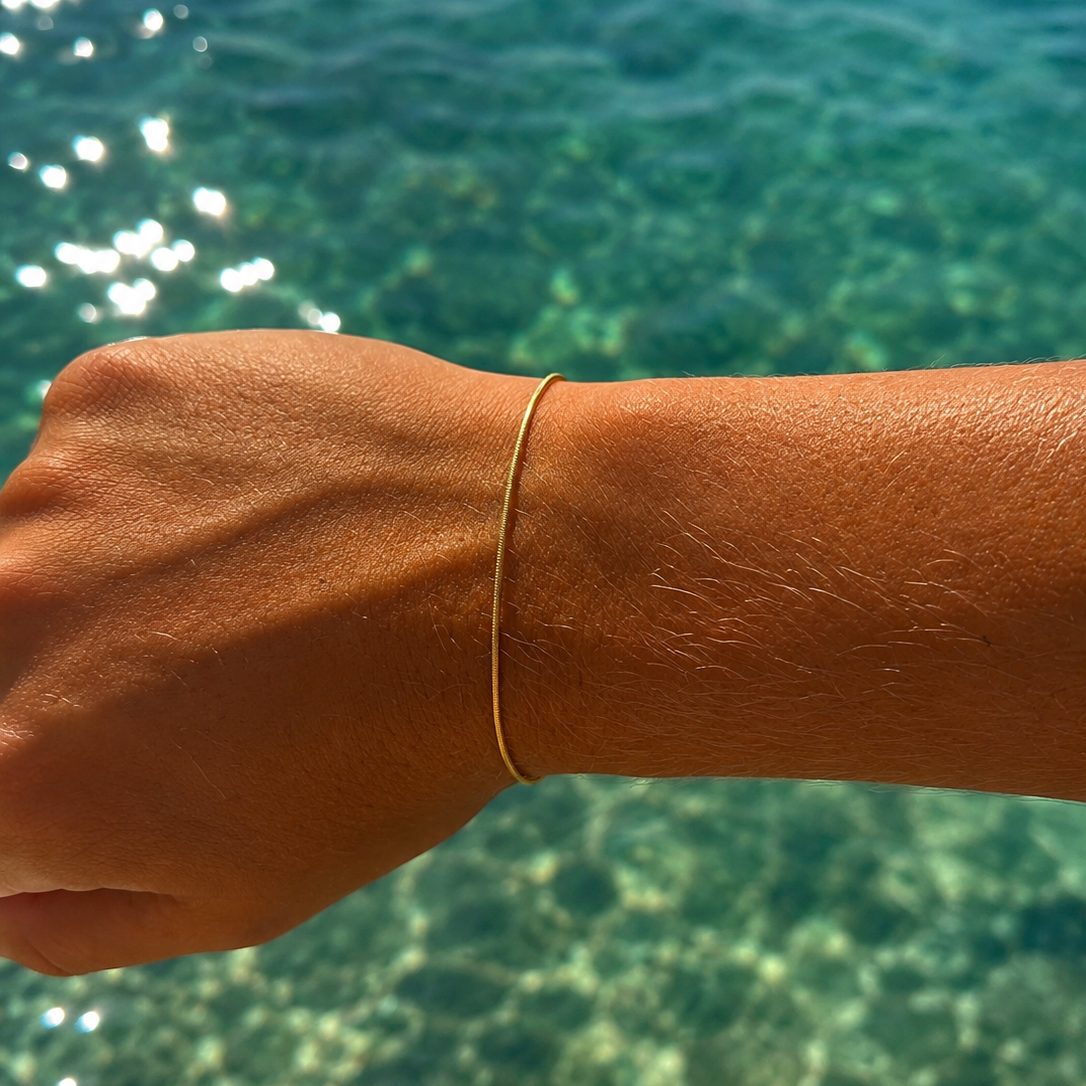 “Gold vermeil bracelet inspired by flowing ocean currents designed in Broome Western Australia”