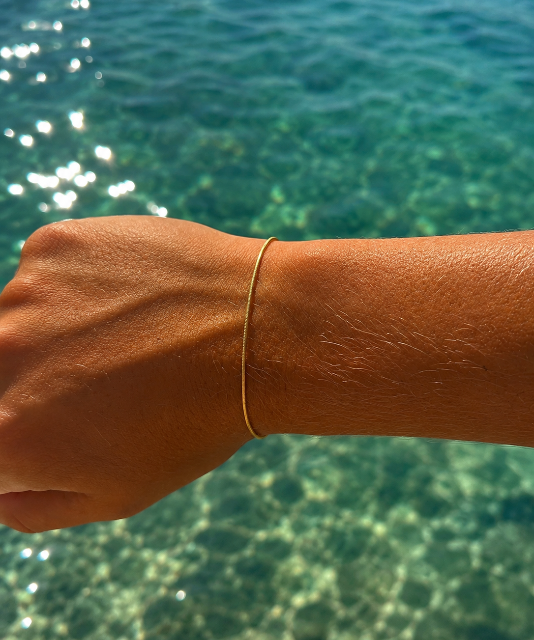 “Gold vermeil bracelet inspired by flowing ocean currents designed in Broome Western Australia”