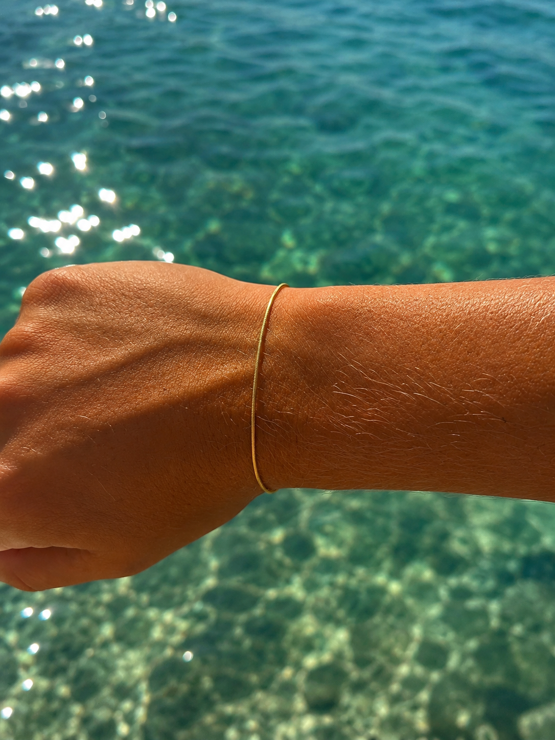 “Gold vermeil bracelet inspired by flowing ocean currents designed in Broome Western Australia”