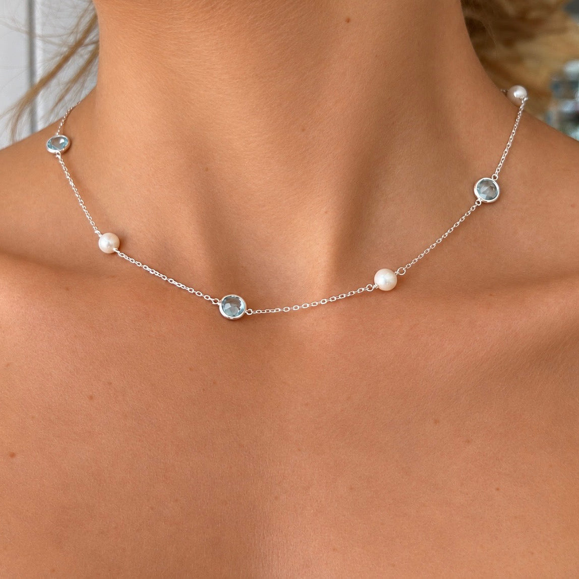 Ocean Dreams sterling silver blue topaz and 9mm freshwater pearl necklace worn on model