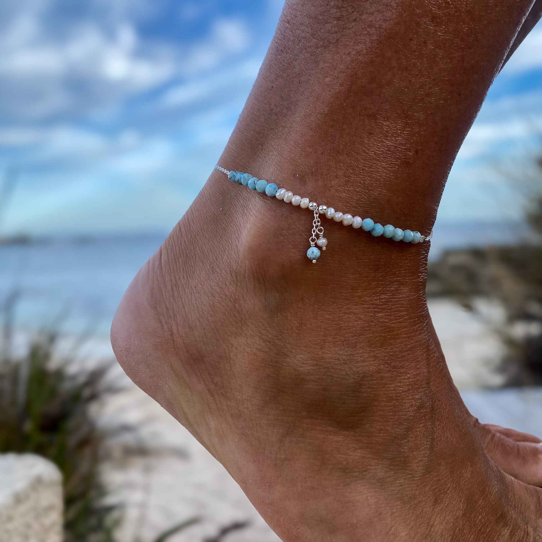 Ocean Spell Pearl Anklet Larimar by Lush Designs Jewellery featuring natural ocean-blue larimar gemstones, white freshwater pearls, sterling silver chain and delicate dangling gemstone and pearl charms.