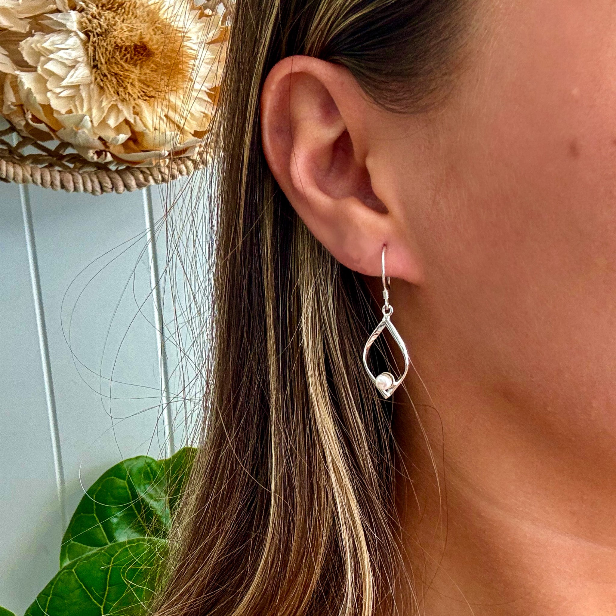 Oceanic Diamonds pearl earrings in 925 sterling silver with open teardrop frame designed in Broome Western Australia
