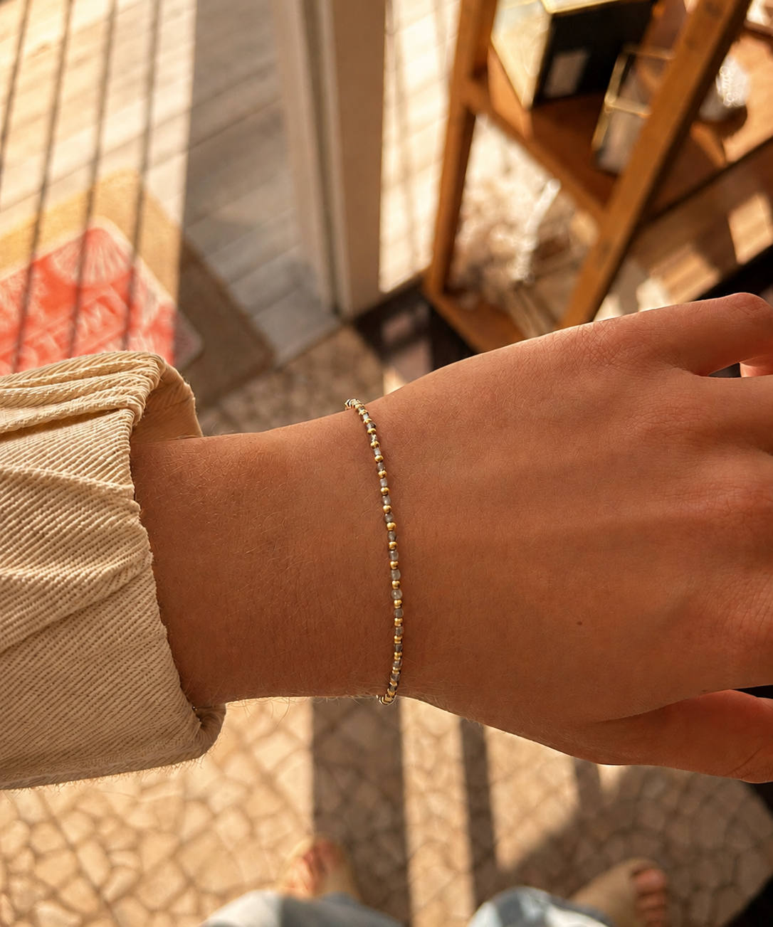 Oceanic Loops Labradorite Bracelet Gold featuring genuine labradorite gemstones with natural  iridescence, accented with gold vermeil beads and an adjustable chain. A delicate beach-inspired bracelet designed in Broome, Western Australia.