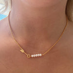 Dainty gold necklace with arrow detail and dainty freshwater pearls