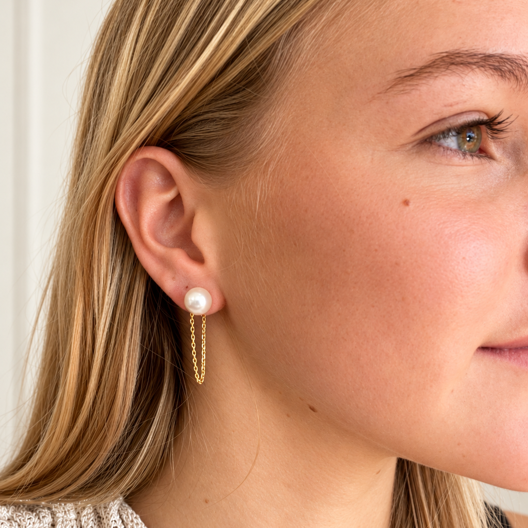 Model wearing Pearl Tide Trails gold vermeil freshwater pearl earrings by Lush Designs Jewellery
