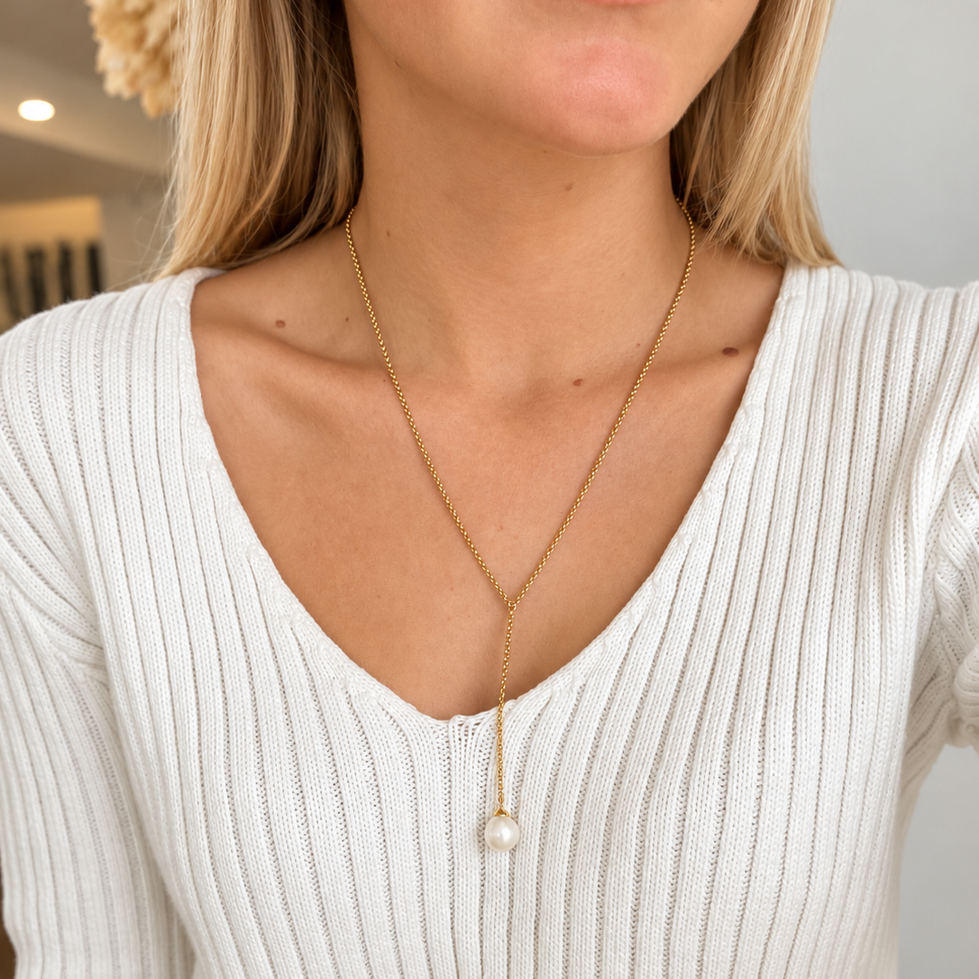 Ricki Pearl Necklace Gold by Lush Designs featuring a delicate gold vermeil Y-shaped chain with a single white freshwater pearl drop