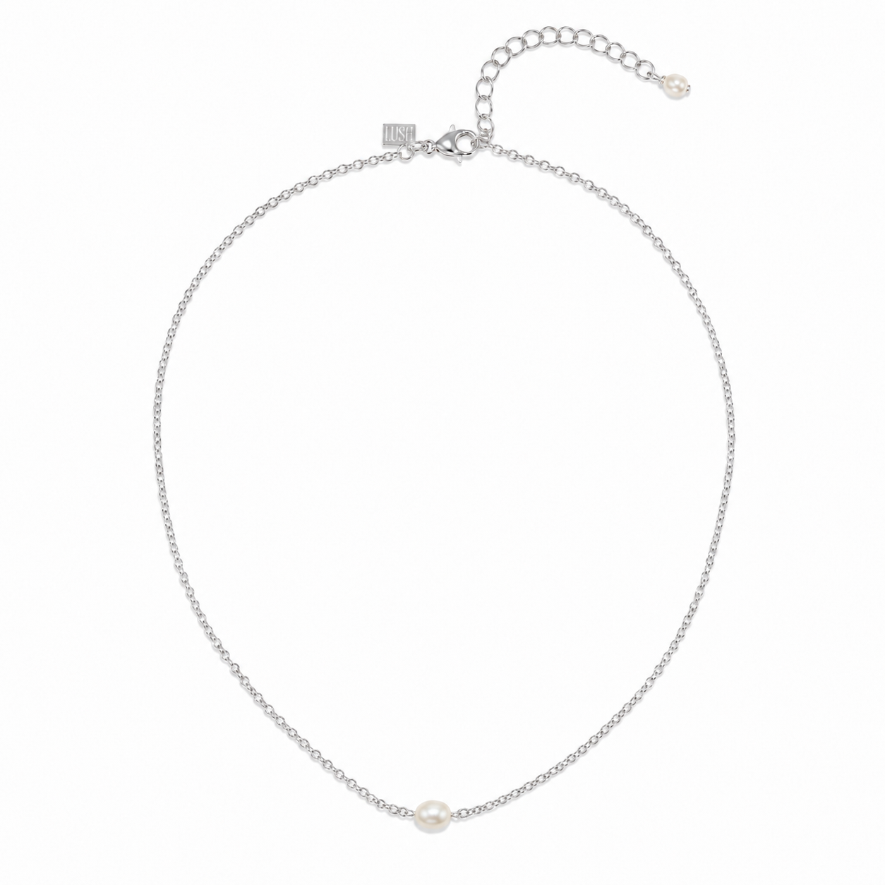 A delicate silver chain necklace featuring a single small white pearl at the center, displayed on a clean white background.