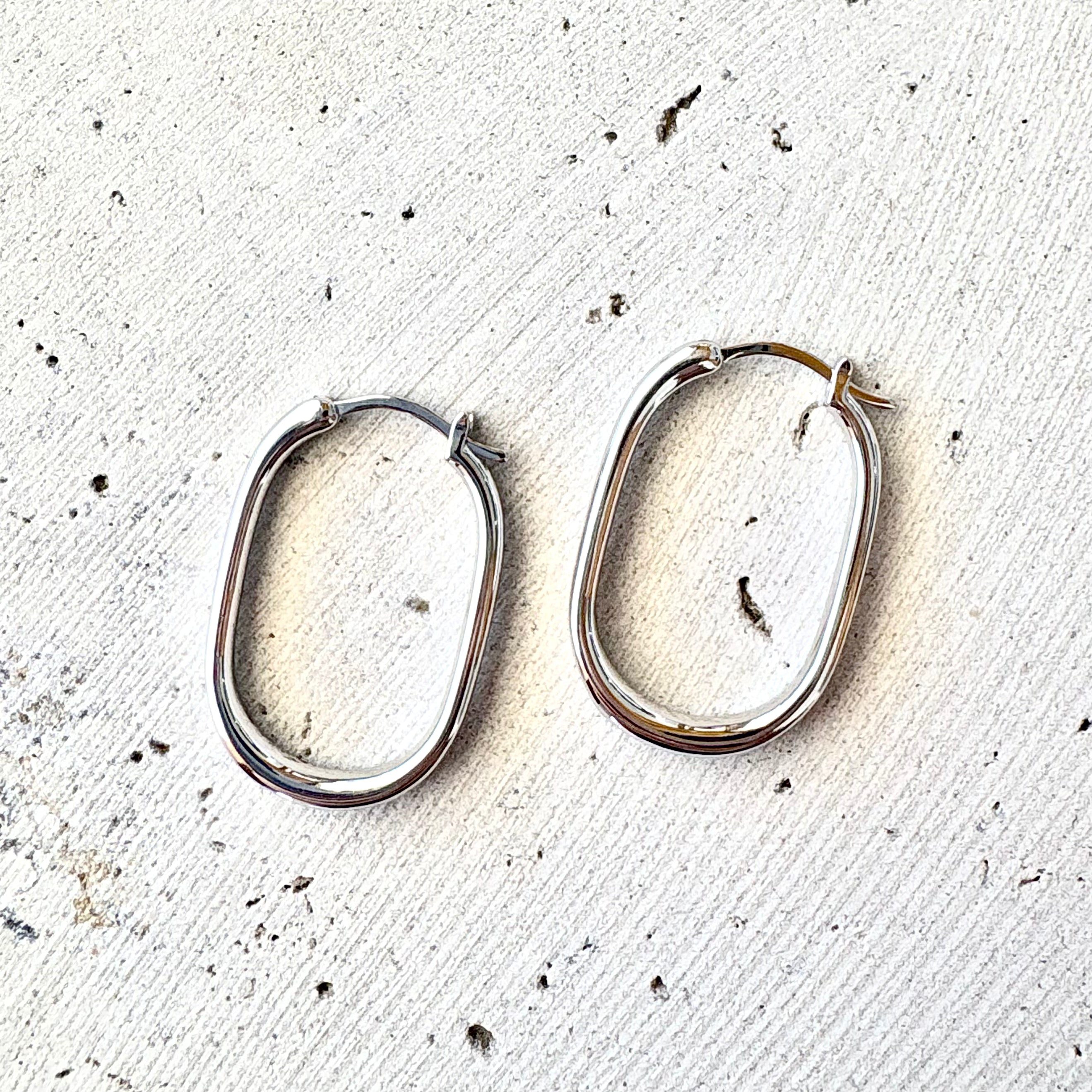 Sterling silver oval hoop earrings with a beachy coastal design, Australian jewellery designed in Broome
