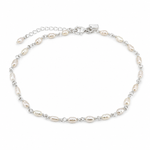 A silver chain anklet featuring irregular white freshwater pearls spaced along the chain, with a lobster clasp and extender chain