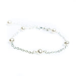 dainty pearl bracelet on silver chain