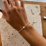 dainty pearl bracelet on silver chain