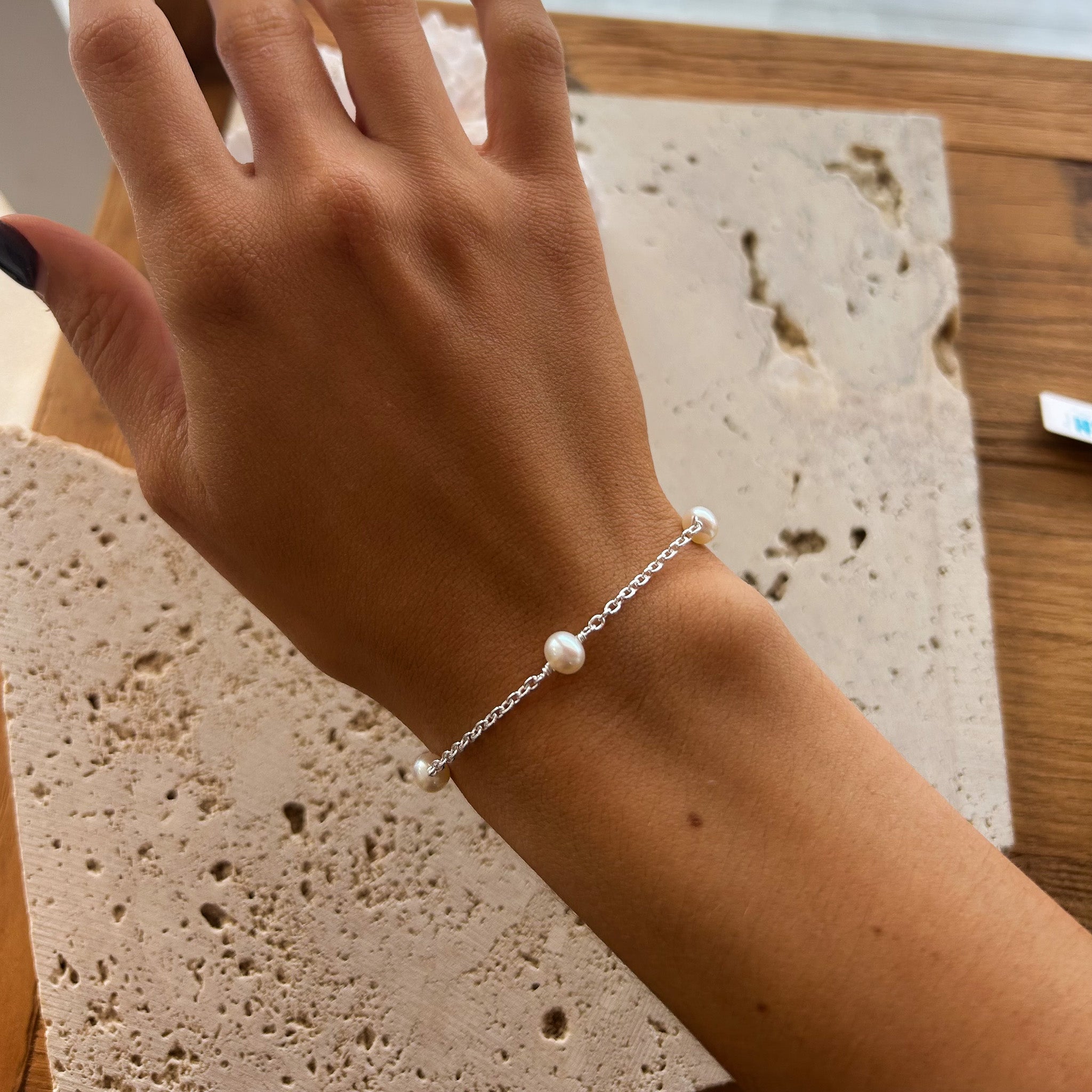 dainty pearl bracelet on silver chain
