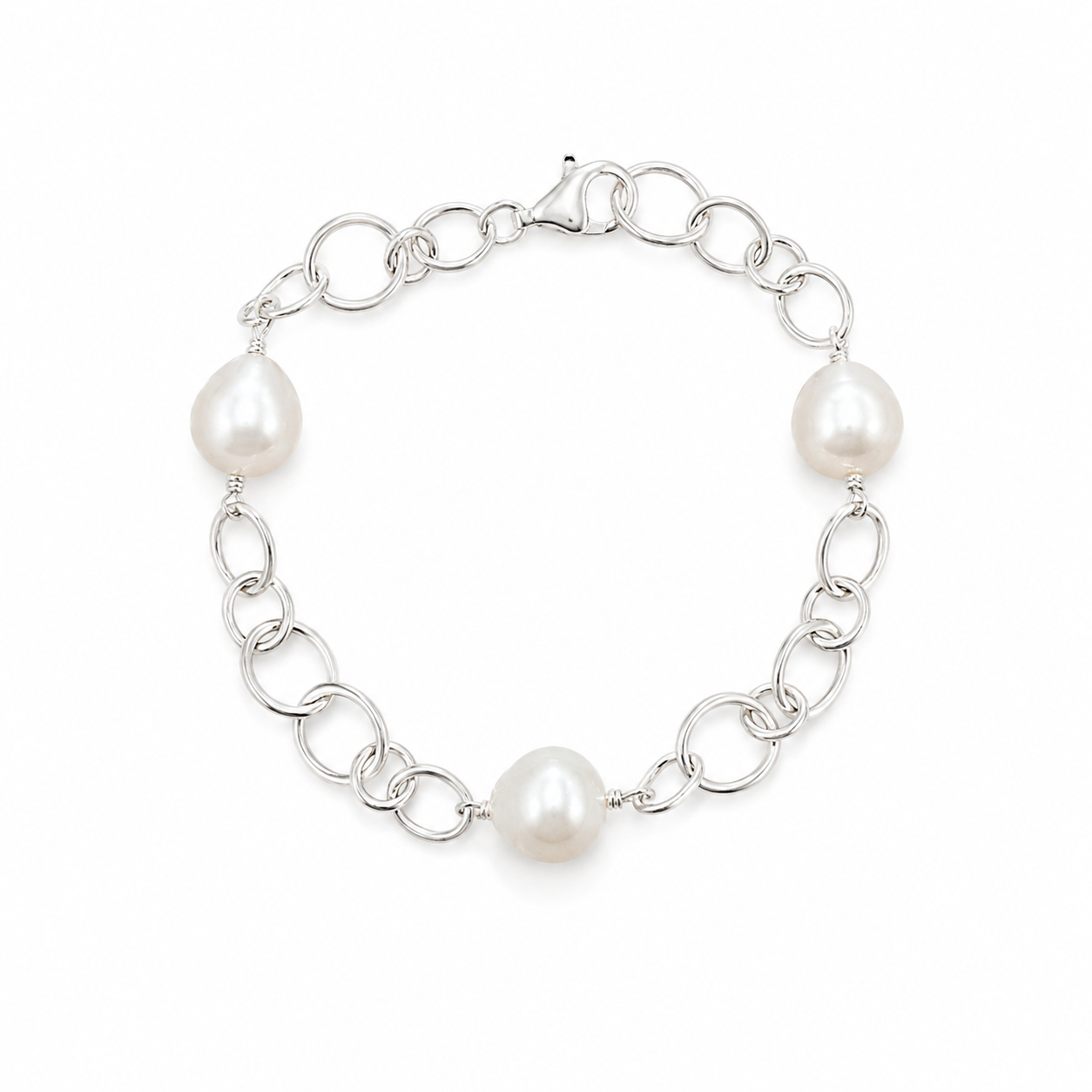 Australian South Sea pearl bracelet featuring three lustrous white pearls on a polished 925 sterling silver link chain