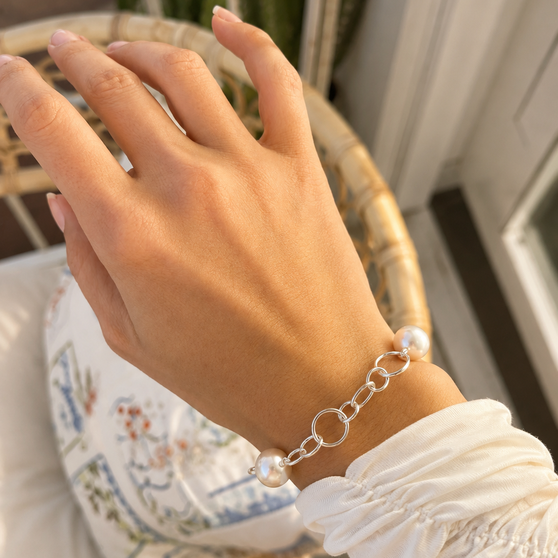 Australian South Sea pearl bracelet featuring three lustrous white pearls on a polished 925 sterling silver link chain