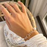 Australian South Sea pearl bracelet featuring three lustrous white pearls on a polished 925 sterling silver link chain