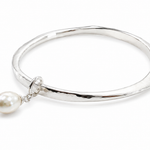 sterling silver bangle with pearl charm
