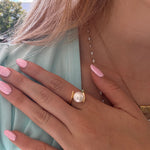 Whirlpool Pearl Ring Gold featuring a genuine freshwater pearl set in a swirling gold vermeil design over 925 sterling silver.