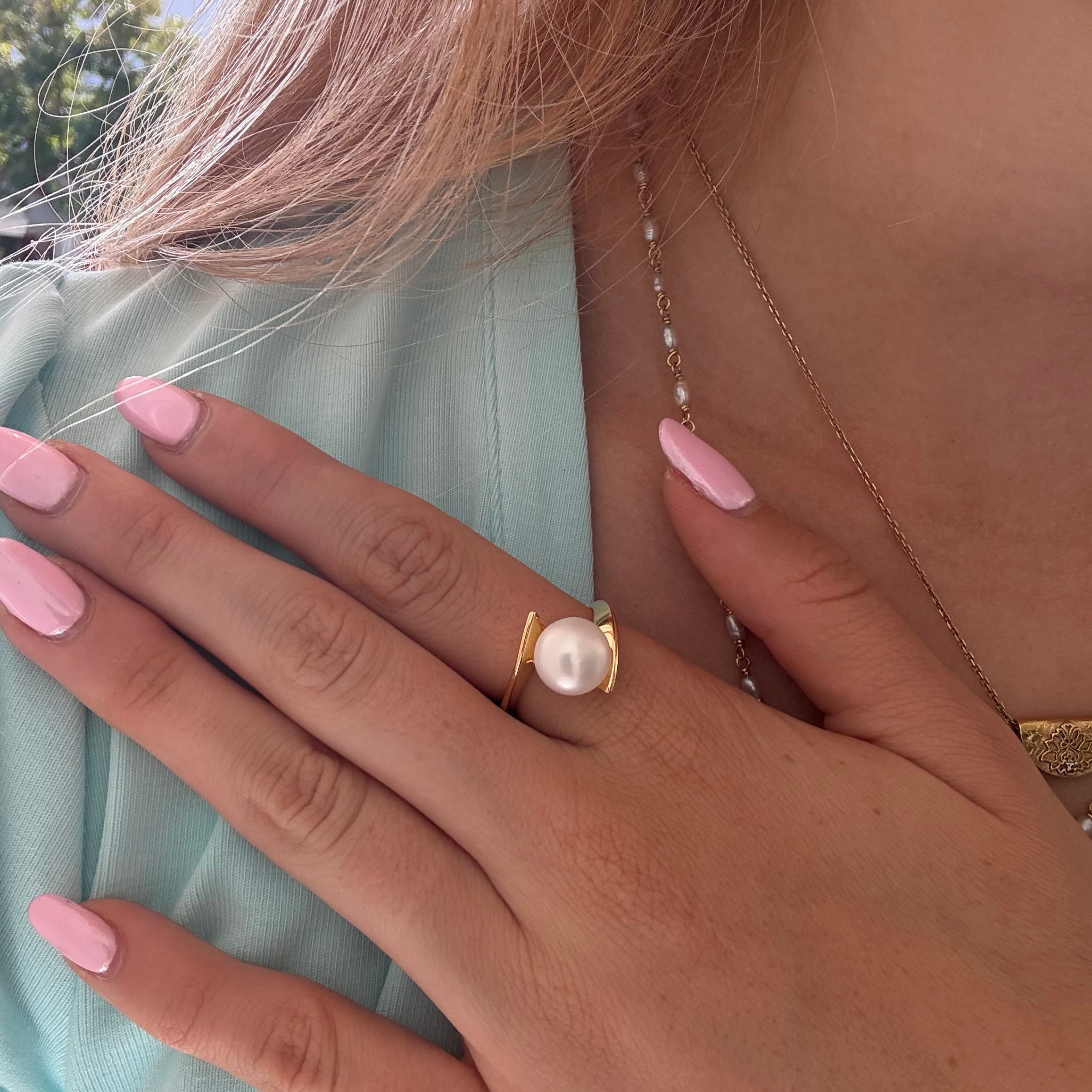 Whirlpool Pearl Ring Gold featuring a genuine freshwater pearl set in a swirling gold vermeil design over 925 sterling silver.