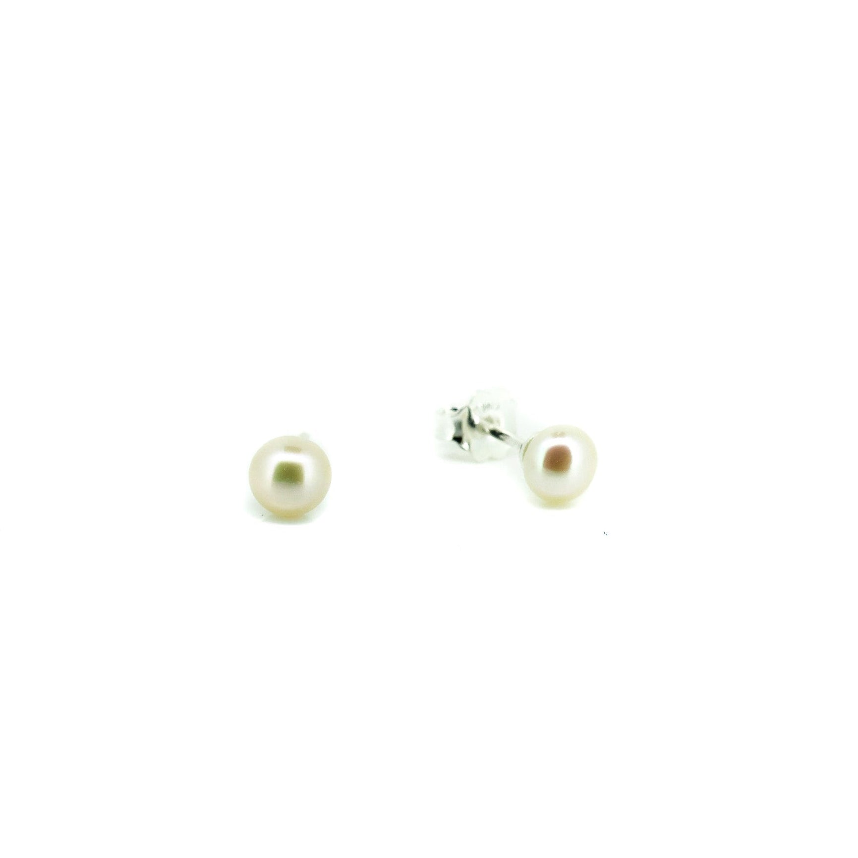 Pair of pearl earrings on a white background