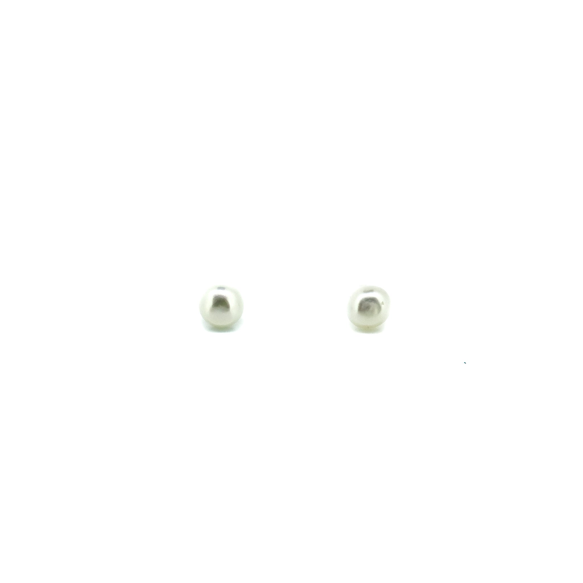 small white pearl studs set in sterling silver
