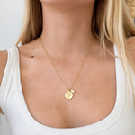 Zodiac Necklace Capricorn Gold in gold vermeil with Capricorn pendant and delicate pearl accent, worn on the neck.
