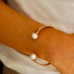 Bold gold cuff bracelet with pearl detail
