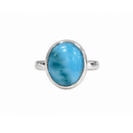 A sterling silver ring featuring a large, oval-shaped cabochon larimar stone with natural light blue and teal marbling, set against a plain white background.