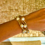 Adjustable freshwater pearl bracelet worn on wrist – beachy boho style