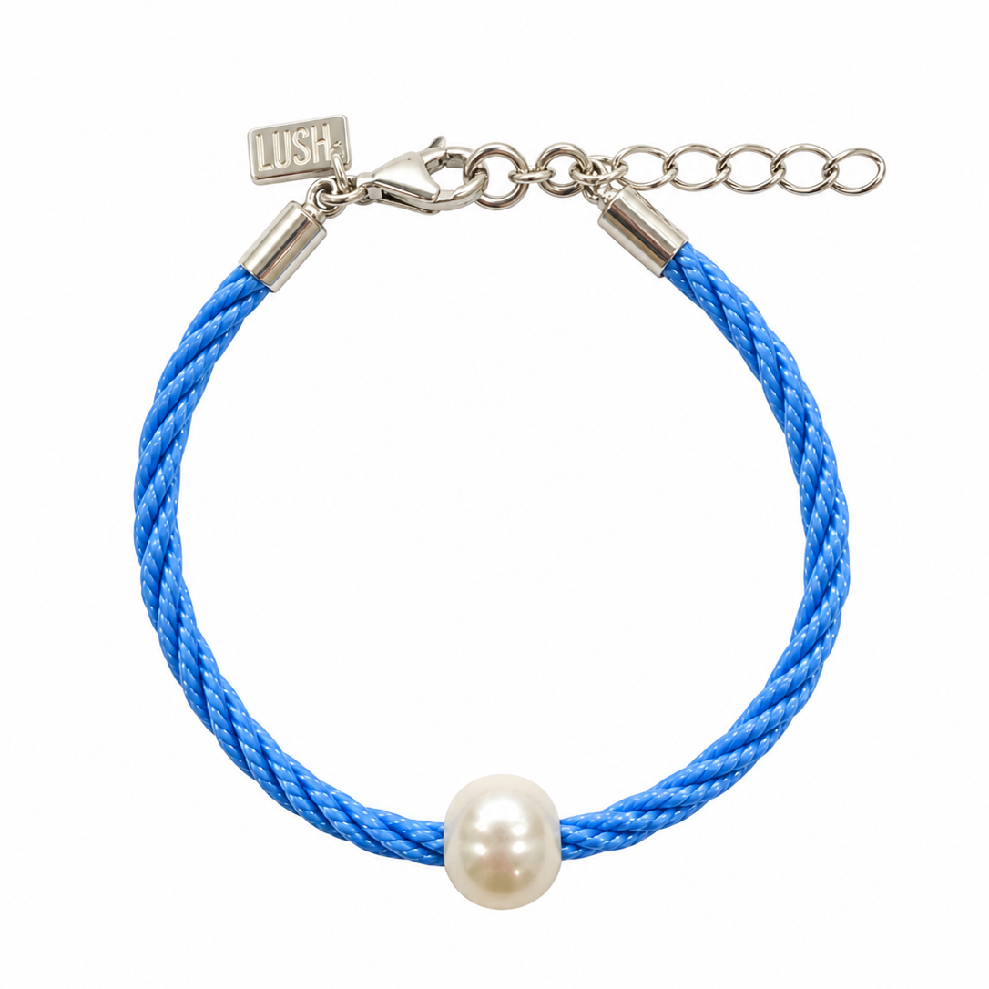 Children’s Pearl Bracelet Dark Blue featuring a natural white freshwater pearl on a dark blue braided cord with sterling silver clasp, adjustable extension chain and signature LUSH tag. Coastal-inspired children's jewellery by Lush Designs Jewellery Australia.
