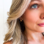 Gold vermeil coastal curl huggie earrings inspired by ocean waves and beachy Australian style