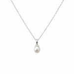 Dainty white freshwater pearl pendant necklace in sterling silver featuring a 9mm pearl on a fine silver chain